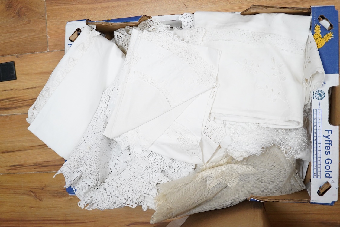 Two boxes of mixed white on white embroidered linen and cotton table cloths etc, some with crochet edging and cut work.